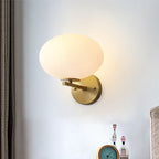 Milk Glass Oval Wall Mount Lamp Modern 1 Light Bedside Wall Sconce Light in Brass