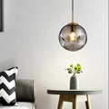 Dimpled Sphere Ceiling Pendant Modern Cognac/Smoke Grey Glass 1 Head Brass Hanging Light Fixture for Living Room