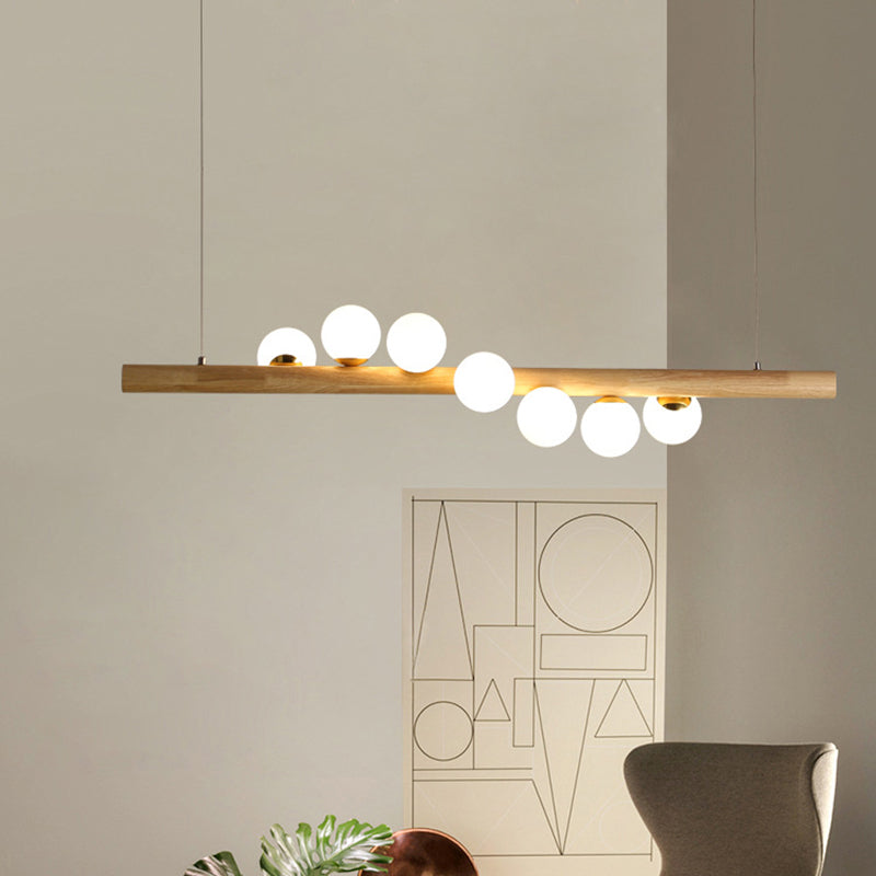 Nordic Linear Wood Island Pendant with Globe Shape Glass Island Light in Beige for Dining Room