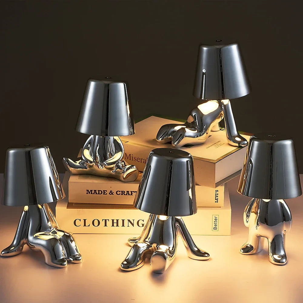 Designer LED Table Lamp Sitting Man with Glossy Finish
