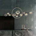 Modern ceiling lamp with spherical shades and a geometric LED ring