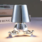 Designer LED Table Lamp Sitting Man with Glossy Finish