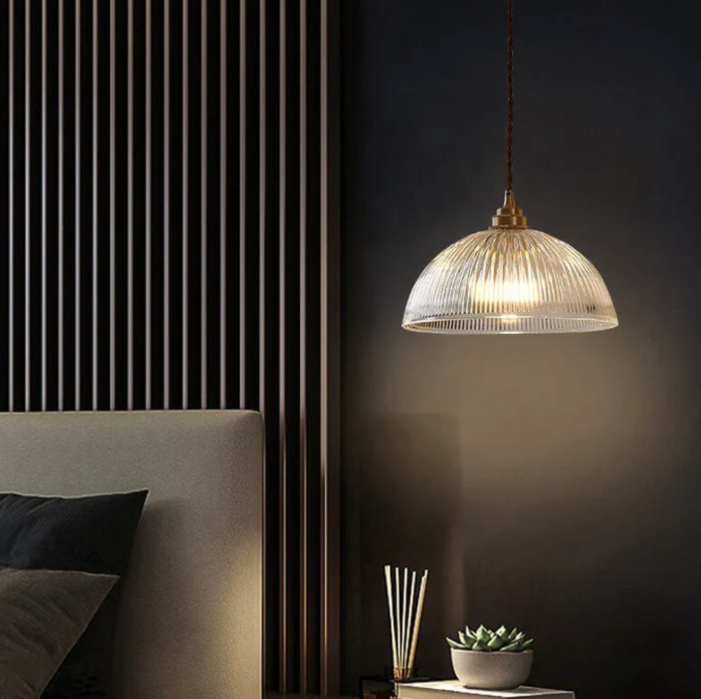 Retro-style glass pendant lamp with an embossed shade and brass finish
