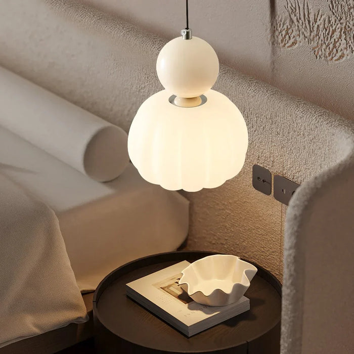 Modern pendant lamp with a spherical decorative element