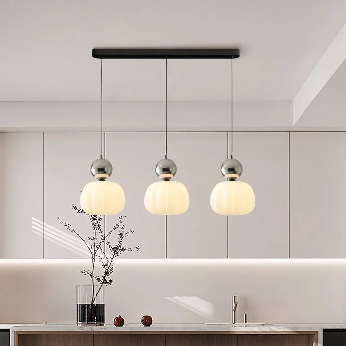 Modern pendant lamp with a spherical decorative element