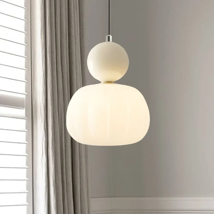 Modern pendant lamp with a spherical decorative element