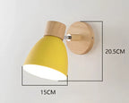 Modern wall lamp with a wooden base and metal shade